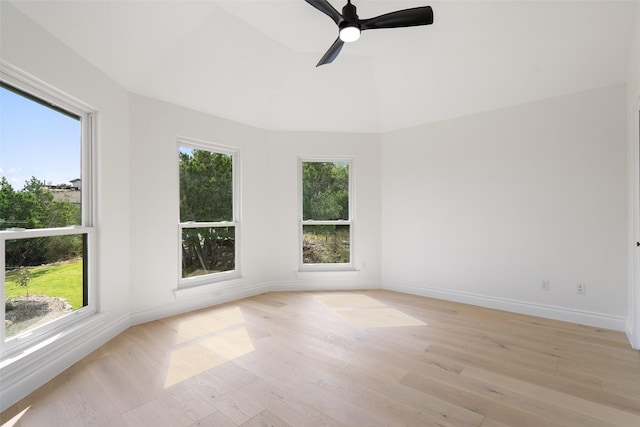 unfurnished room featuring light hardwood / wood-style floors, a wealth of natural light, and ceiling fan