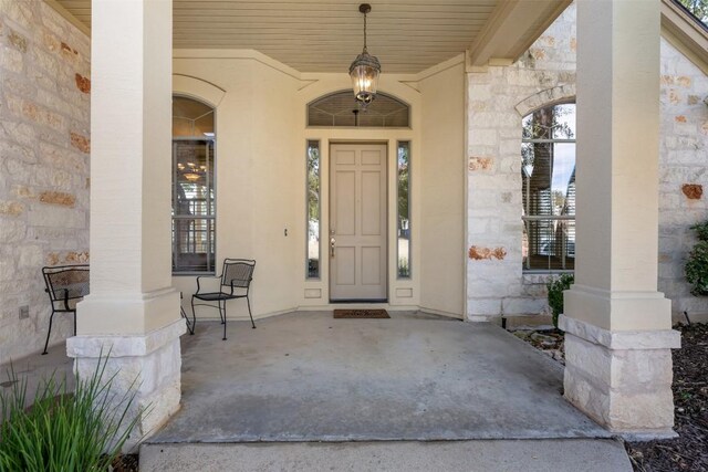 entrance to property featuring covered porch