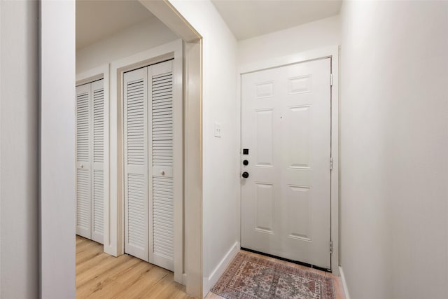 doorway to outside with light hardwood / wood-style flooring