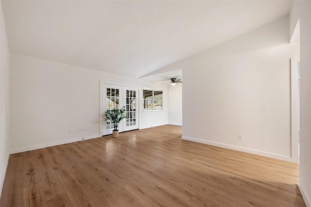 spare room featuring ceiling fan, french doors, vaulted ceiling, and hardwood / wood-style flooring