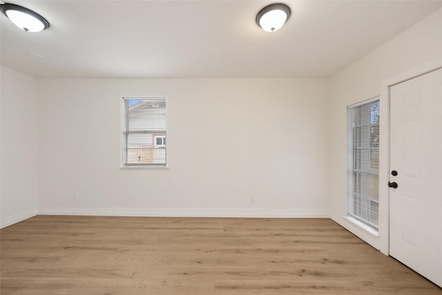 empty room with light hardwood / wood-style floors