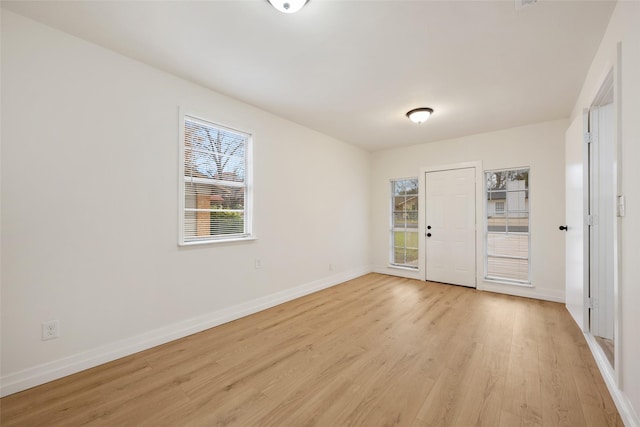 spare room featuring light hardwood / wood-style flooring