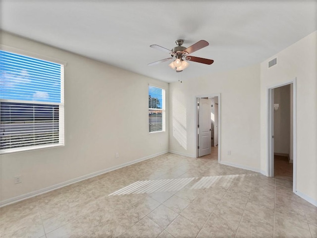 1276 Nevarez, Kyle, TX 78640 - unfurnished bedroom with light tile patterned flooring, baseboards, and a ceiling fan