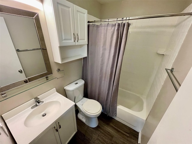 full bathroom featuring hardwood / wood-style flooring, toilet, vanity, and shower / tub combo with curtain