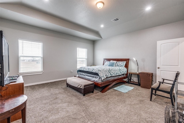 carpeted bedroom featuring lofted ceiling