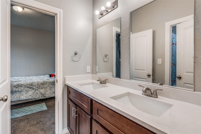 bathroom with vanity and a textured ceiling