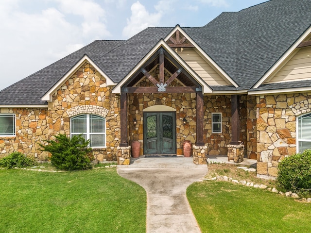 view of front facade with french doors and a front yard