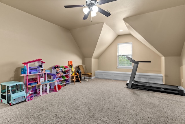 workout area with ceiling fan, lofted ceiling, and carpet flooring