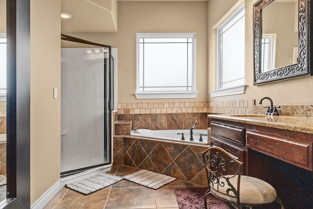 bathroom with vanity, tile patterned floors, and shower with separate bathtub