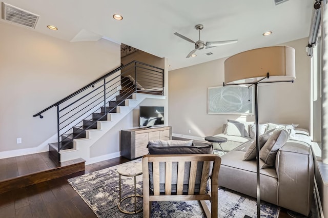 living room featuring ceiling fan and hardwood / wood-style floors