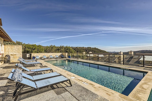 view of swimming pool featuring a patio