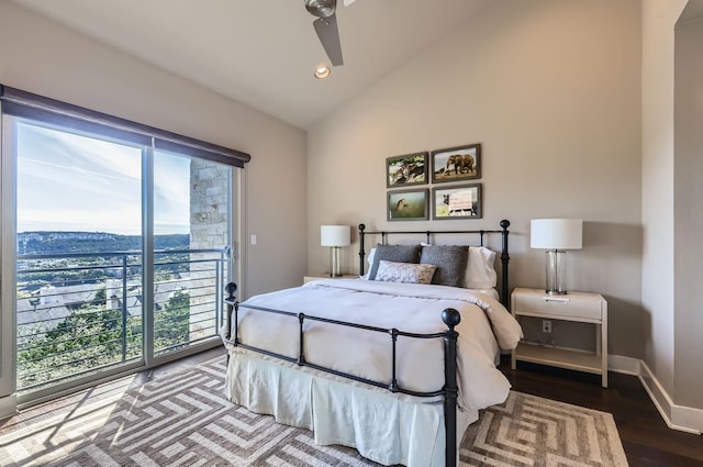 bedroom with ceiling fan, wood-type flooring, access to exterior, and multiple windows