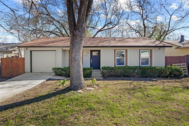 single story home featuring a front lawn and a garage