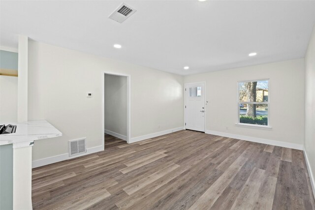 unfurnished living room featuring light wood-type flooring