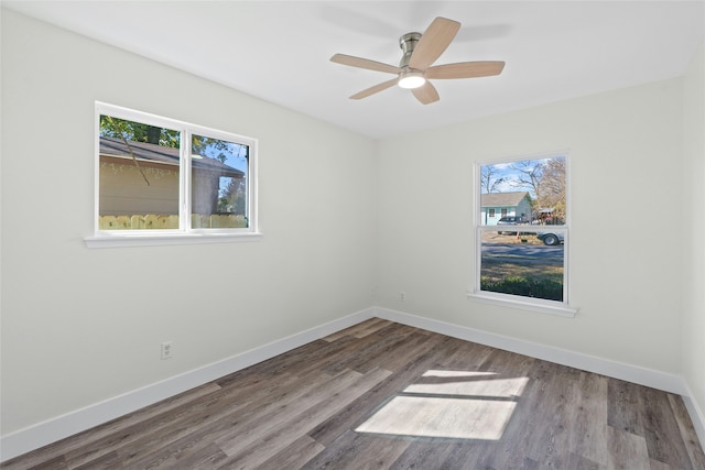 unfurnished room with ceiling fan and hardwood / wood-style floors