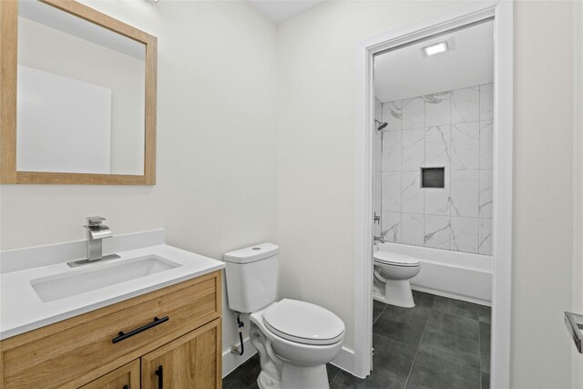 full bathroom with toilet, vanity, and tiled shower / bath combo