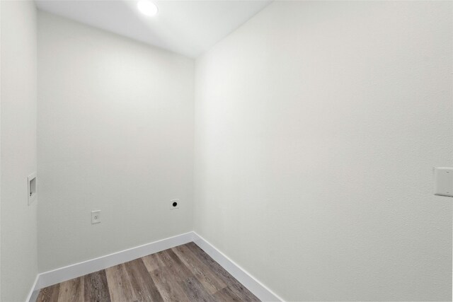 laundry room with wood-type flooring and hookup for an electric dryer