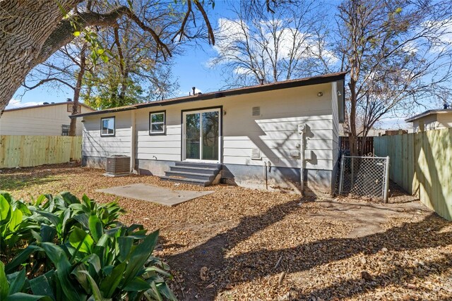 back of house featuring a patio area and cooling unit