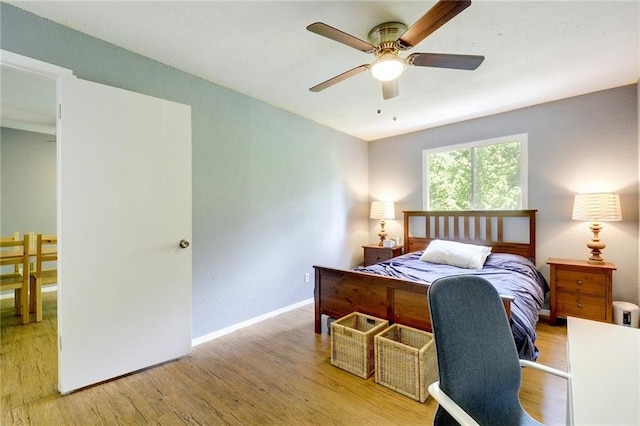 bedroom featuring ceiling fan and light hardwood / wood-style floors