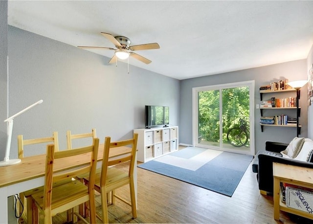 710 E Dean Keeton St Unit 210, Austin, TX 78705 - dining area featuring ceiling fan and wood finished floors