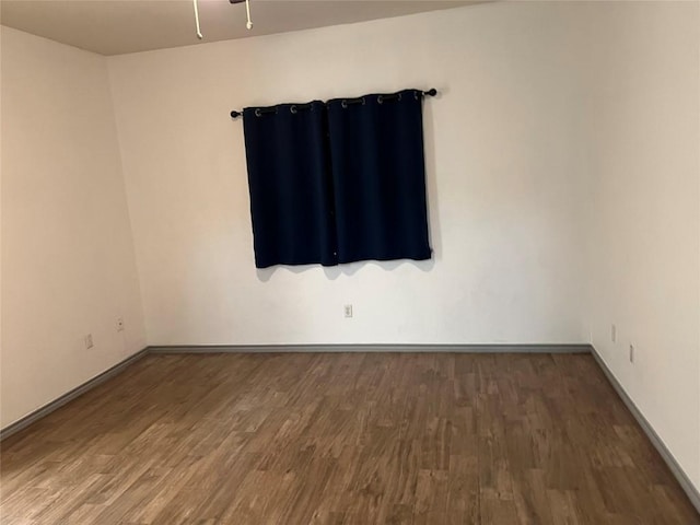 8200 Neely Dr Unit 117, Austin, TX 78759 - spare room featuring wood finished floors, baseboards, and ceiling fan