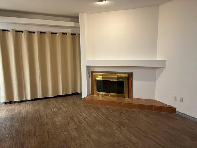 8200 Neely Dr Unit 117, Austin, TX 78759 - unfurnished living room featuring wood finished floors and a tile fireplace