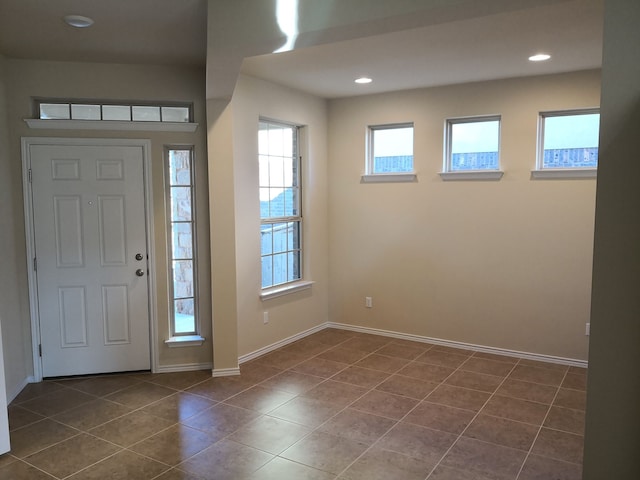 foyer with dark tile patterned flooring