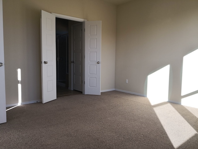 unfurnished room with carpet floors