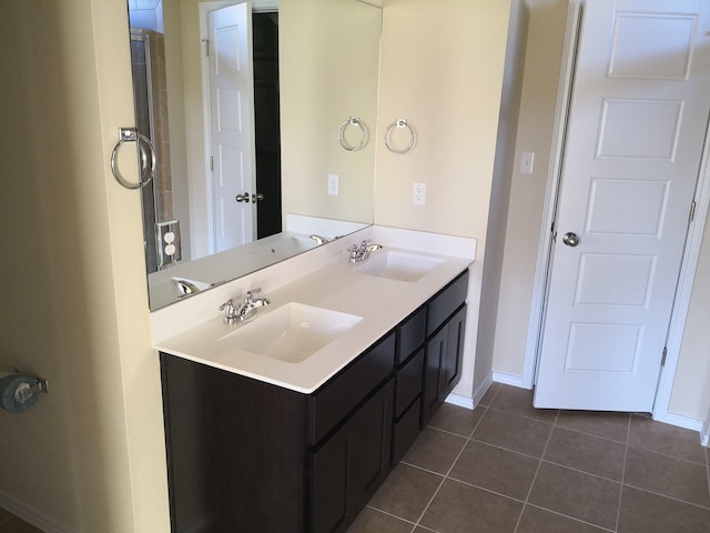 bathroom with vanity and tile patterned flooring