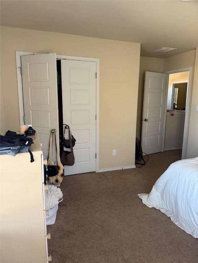 carpeted bedroom featuring a closet