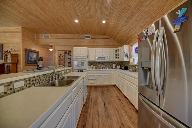 kitchen featuring lofted ceiling, sink, white appliances, white cabinetry, and wooden ceiling