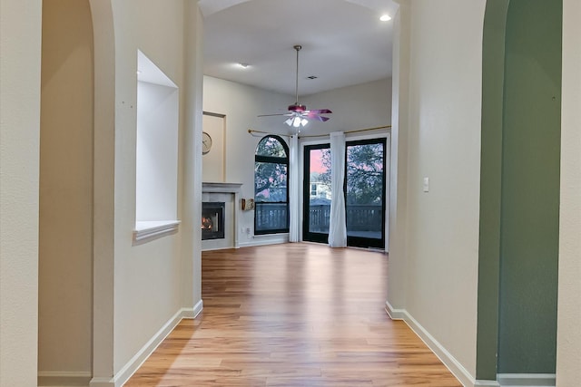 corridor with light hardwood / wood-style flooring