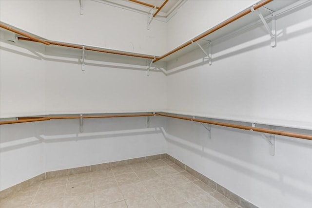 6817 Beatty Dr, Austin, TX 78749 - spacious closet featuring light tile patterned floors