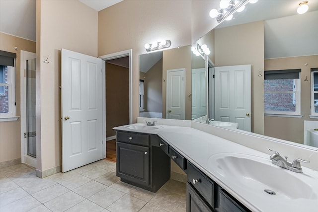 bathroom featuring vanity, vaulted ceiling, tile patterned floors, and a shower with door