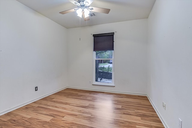 spare room with ceiling fan and light hardwood / wood-style floors