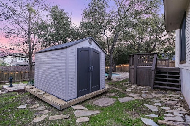 6817 Beatty Dr, Austin, TX 78749 - view of shed with a fenced backyard and stairway