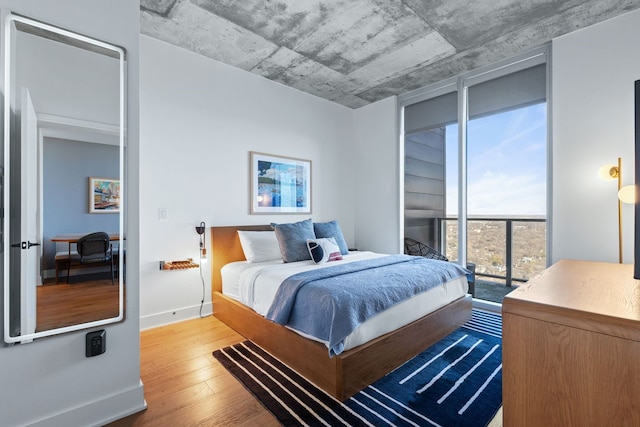 bedroom with hardwood / wood-style flooring