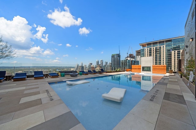 view of swimming pool featuring a patio