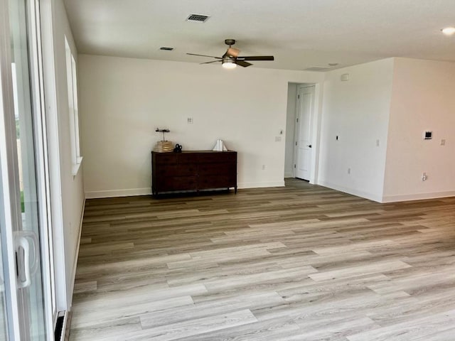 17101 Astral Ln, Manor, TX 78653 - spare room with a ceiling fan, light wood finished floors, and baseboards