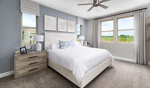 carpeted bedroom with ceiling fan