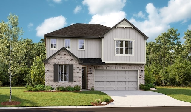 view of front of house with a front yard and a garage