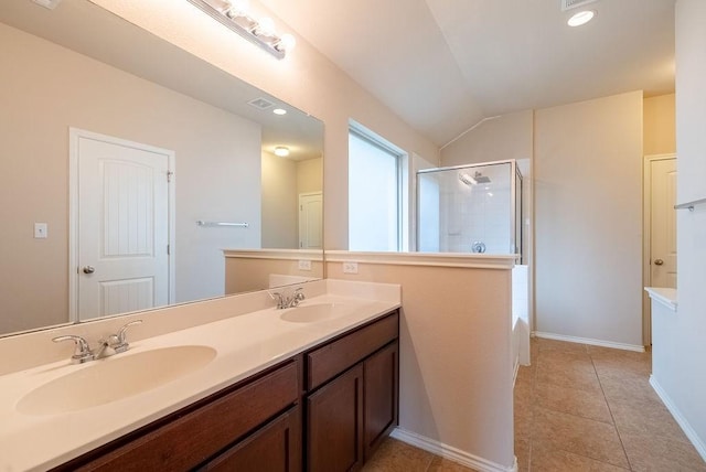 bathroom featuring vanity, lofted ceiling, shower with separate bathtub, and tile patterned floors