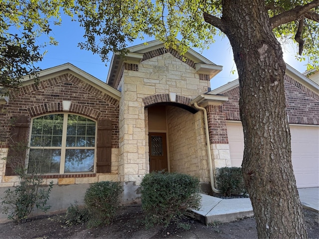 view of exterior entry featuring a garage