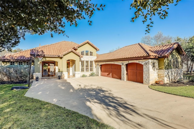 mediterranean / spanish house featuring a garage