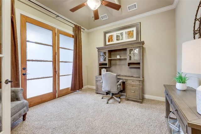 carpeted home office featuring ornamental molding and ceiling fan