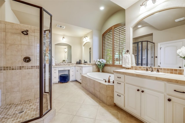 bathroom featuring vanity, tile patterned flooring, and independent shower and bath