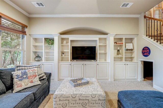 carpeted living room with ornamental molding