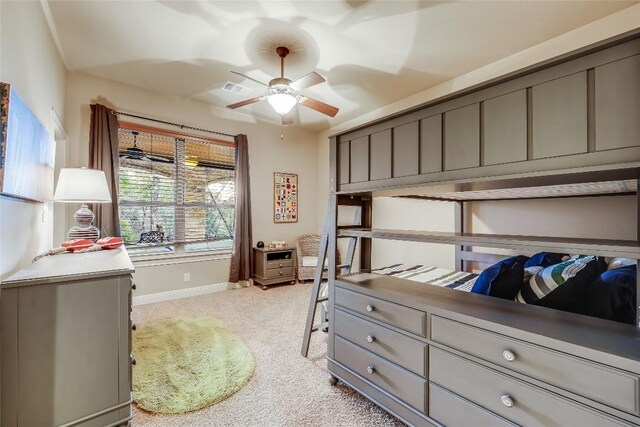 bedroom featuring ceiling fan and light carpet