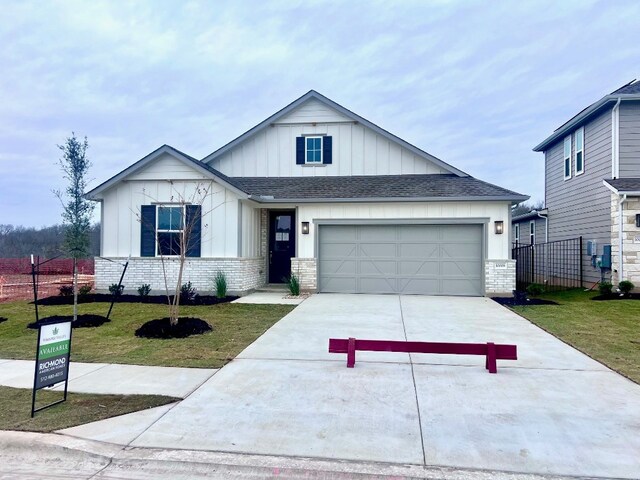 view of front facade with a front yard and a garage