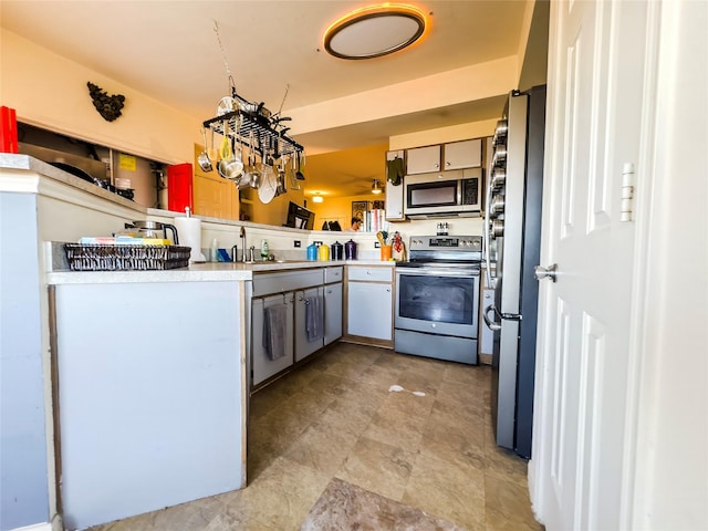 kitchen with sink, kitchen peninsula, and stainless steel appliances